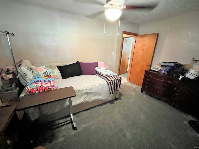 bedroom featuring ceiling fan and carpet