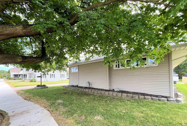 view of property exterior featuring a yard