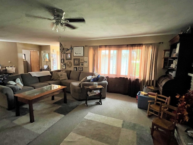 living room featuring ceiling fan and carpet flooring