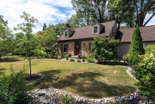 cape cod house featuring a front lawn