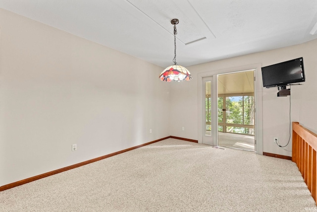 spare room featuring carpet floors