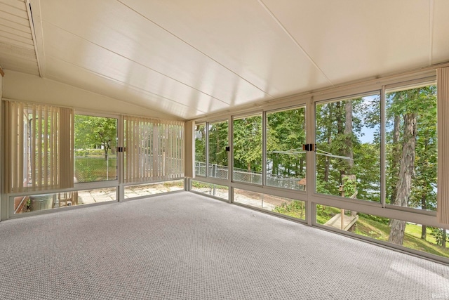 unfurnished sunroom with lofted ceiling