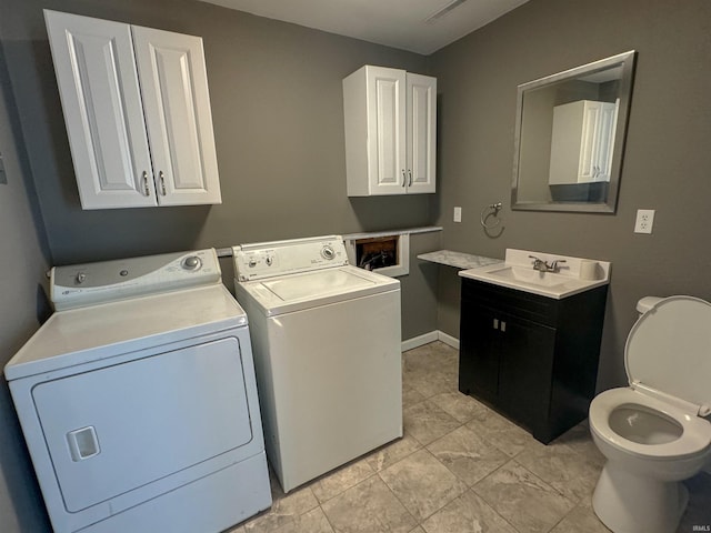 laundry area featuring separate washer and dryer and sink