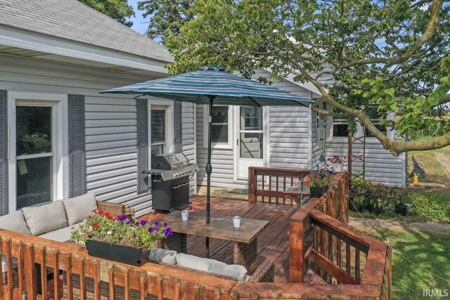 back of house with a lawn and a deck