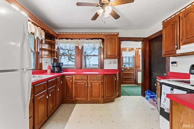 kitchen with ceiling fan, light tile patterned flooring, and white electric stove