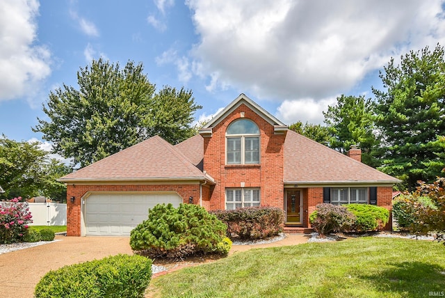 front of property with a front lawn and a garage