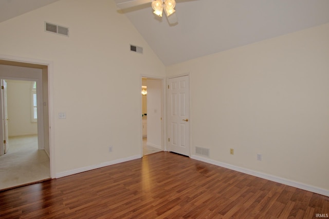 spare room featuring high vaulted ceiling, carpet, and ceiling fan