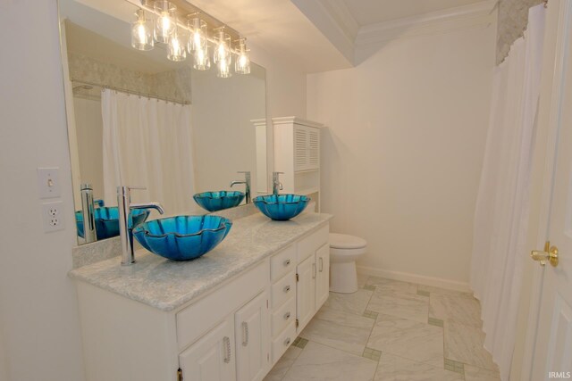 bathroom featuring ornamental molding, vanity, tile patterned flooring, and toilet