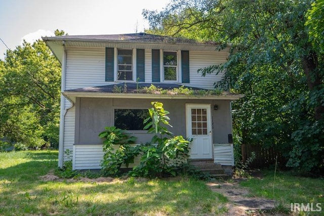 view of front of home with a front yard