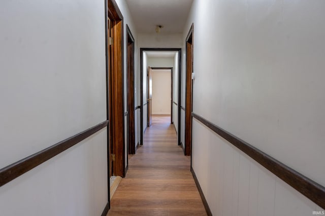 hall with wood-type flooring