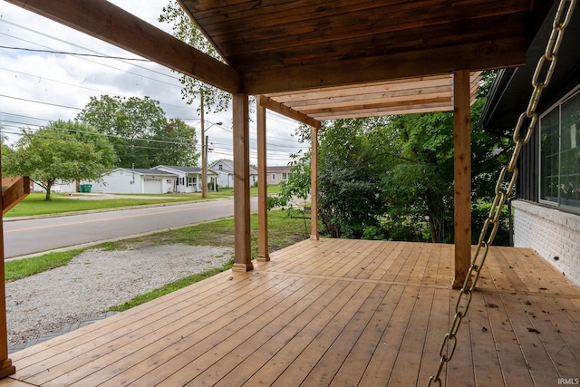 wooden deck featuring a garage