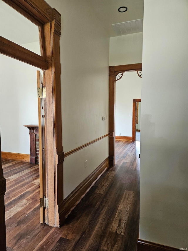 hallway featuring dark wood-type flooring