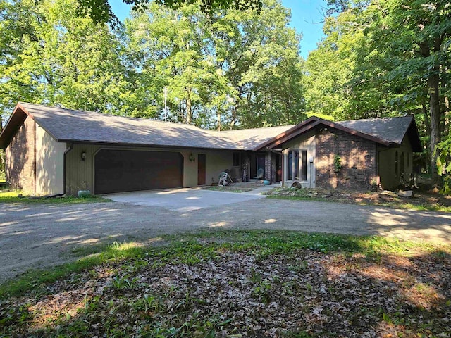 ranch-style house featuring a garage