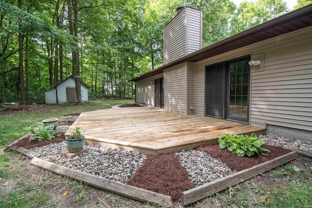 wooden terrace featuring a storage shed