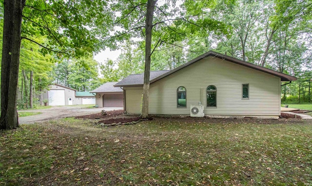 view of side of home featuring a garage