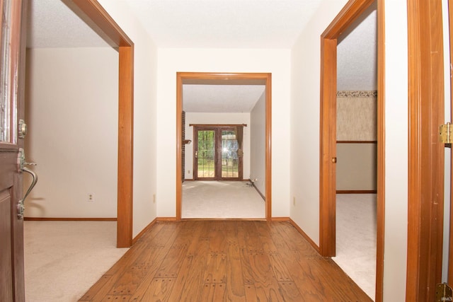 hallway with wood-type flooring