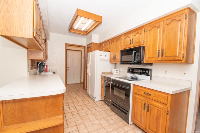 kitchen with sink, white appliances, and light tile patterned flooring