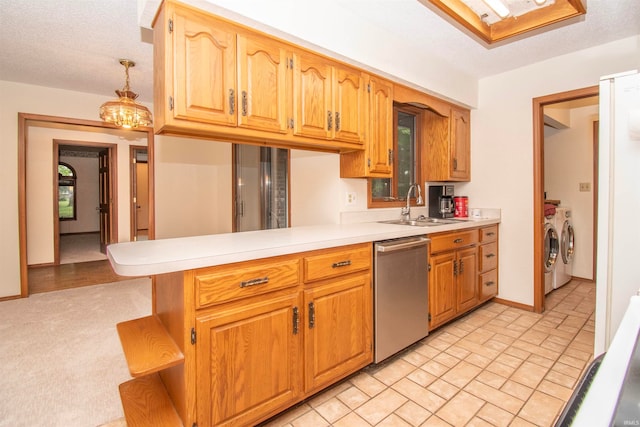 kitchen featuring dishwasher, separate washer and dryer, sink, light colored carpet, and kitchen peninsula