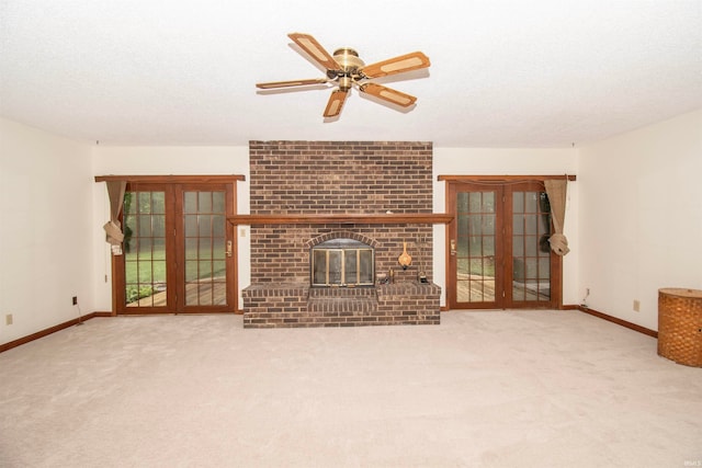 unfurnished living room featuring carpet flooring, ceiling fan, and french doors