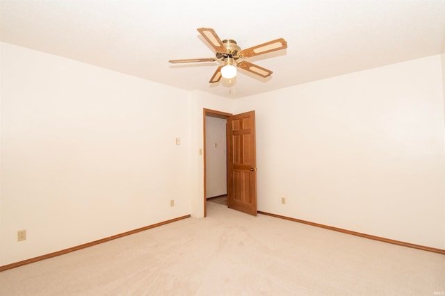 unfurnished room with ceiling fan and carpet flooring