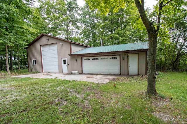 garage with a lawn