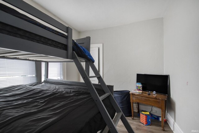 bedroom with hardwood / wood-style floors