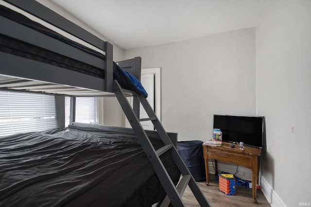 bedroom with hardwood / wood-style floors