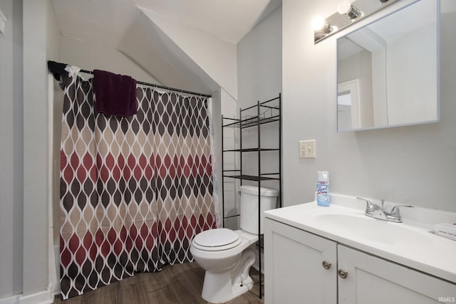 bathroom with vanity, hardwood / wood-style floors, curtained shower, and toilet