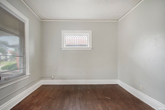 unfurnished room with plenty of natural light, hardwood / wood-style flooring, and crown molding