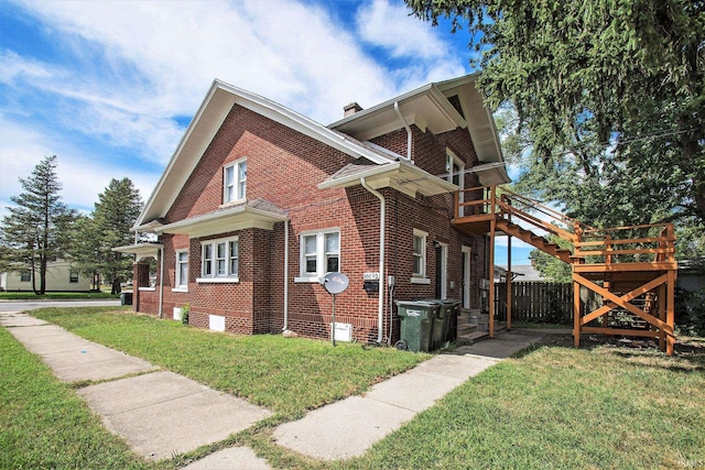 view of side of home featuring a yard