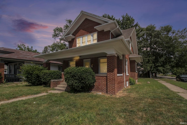 view of front of house with a lawn