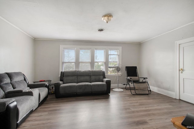 living room featuring ornamental molding and hardwood / wood-style floors