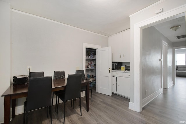 dining area featuring light wood-type flooring