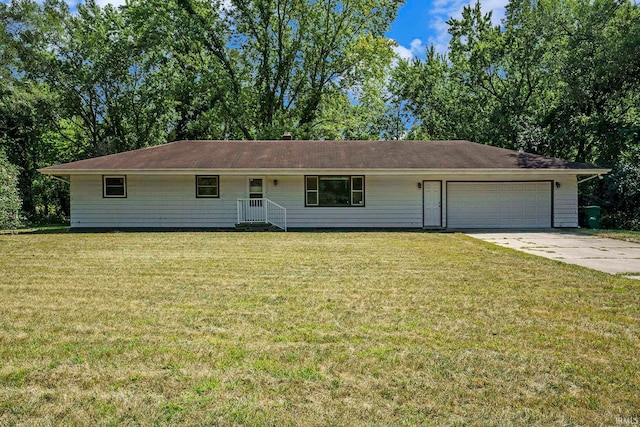 ranch-style house featuring a garage and a front yard