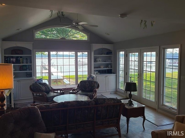 home office featuring a healthy amount of sunlight, vaulted ceiling, ceiling fan, and built in features