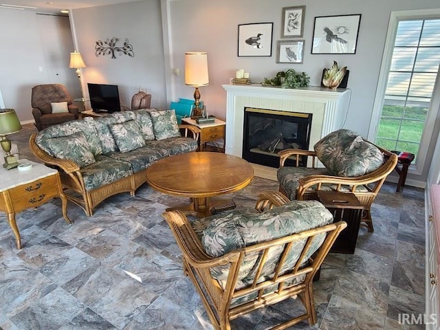 living room with a tile fireplace