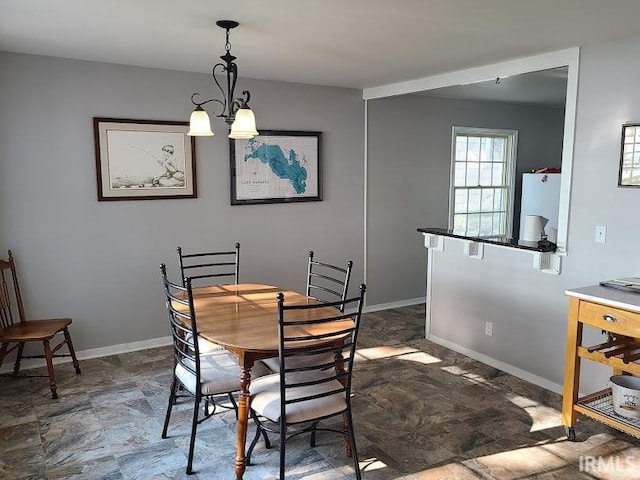 dining room with a chandelier