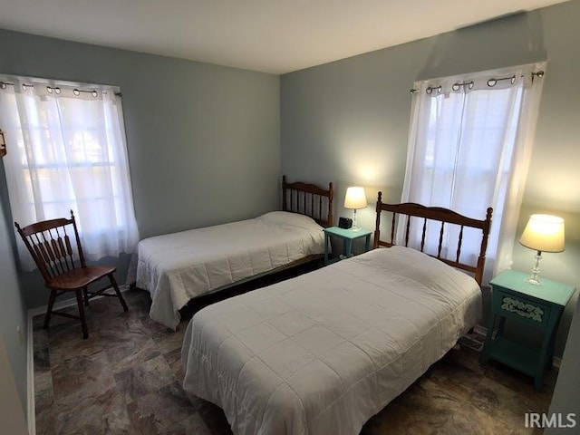 bedroom with multiple windows