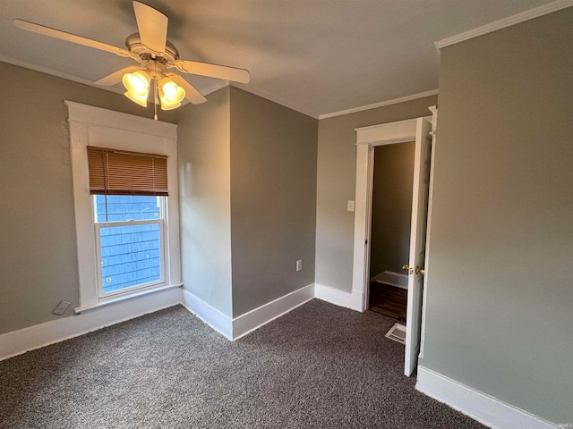 unfurnished room with ceiling fan, carpet flooring, and crown molding