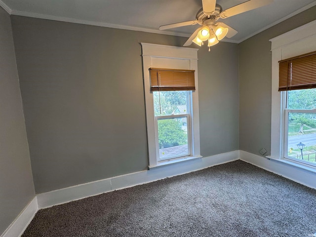 carpeted empty room featuring crown molding, ceiling fan, and a healthy amount of sunlight