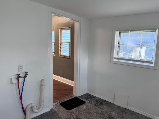 interior space with dark hardwood / wood-style floors and plenty of natural light