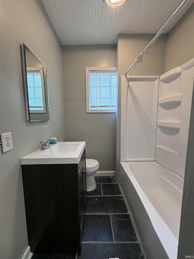 full bathroom featuring washtub / shower combination, toilet, tile patterned floors, and vanity