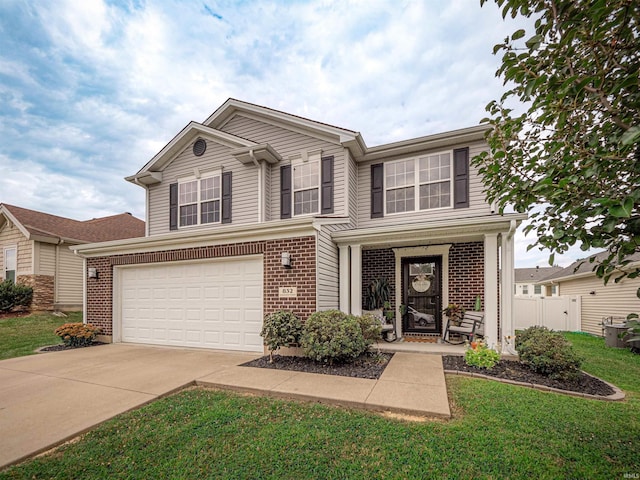 view of front of house featuring a garage and a front lawn