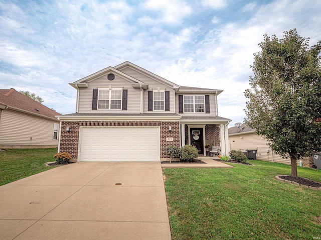 view of property featuring a front yard and a garage