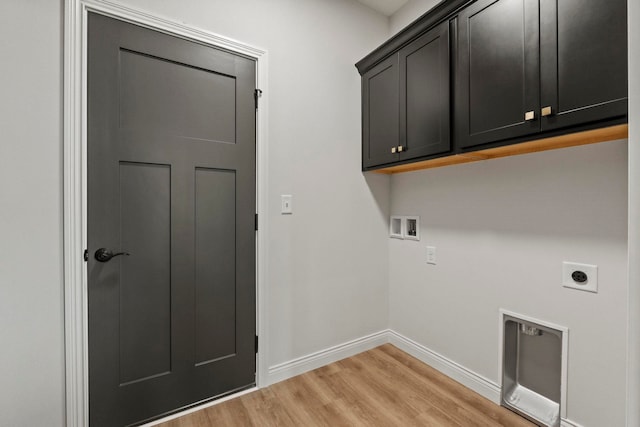 washroom featuring hookup for a washing machine, cabinets, light wood-type flooring, and electric dryer hookup