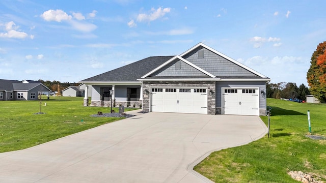 craftsman-style home featuring a front yard and a garage