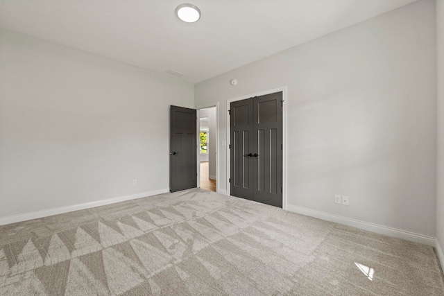 empty room with light colored carpet