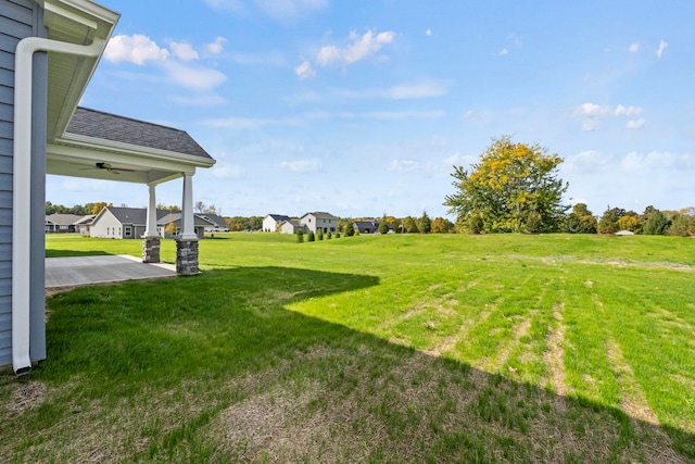 view of yard featuring ceiling fan