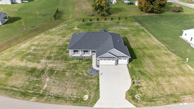 birds eye view of property with a rural view