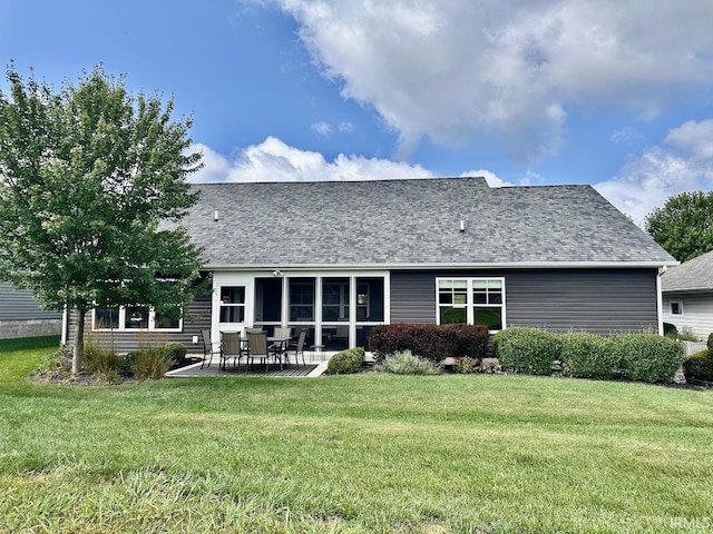 back of house with a patio area, a shingled roof, and a yard